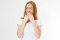 Young red-head woman covering her mouth,  on white, girl talk too much Royalty Free Stock Photo