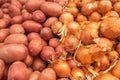 Young red potatoes and onions for sale at city market Royalty Free Stock Photo