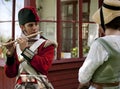Young redcoat plays the flute