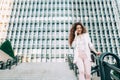 Young redhead business woman walking on the stairs Royalty Free Stock Photo