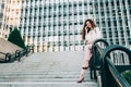 Young redhead business woman walking on the stairs Royalty Free Stock Photo