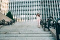Young redhead business woman walking on the stairs Royalty Free Stock Photo