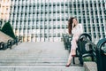 Young redhead business woman walking on the stairs Royalty Free Stock Photo