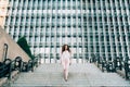 Young redhead business woman walking on the stairs Royalty Free Stock Photo