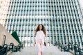 Young redhead business woman walking on the stairs Royalty Free Stock Photo