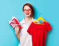 Young redhead designer with dress and gumshoes