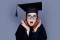 Graduate girl in square academic cap and mantle Royalty Free Stock Photo