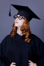 Graduate girl in square academic cap and mantle Royalty Free Stock Photo