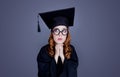 Graduate girl in square academic cap and mantle Royalty Free Stock Photo