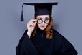 Graduate girl in square academic cap and mantle Royalty Free Stock Photo