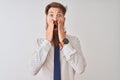 Young redhead irish businessman standing over isolated white background afraid and shocked, surprise and amazed expression with Royalty Free Stock Photo