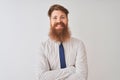 Young redhead irish businessman standing over isolated white background happy face smiling with crossed arms looking at the camera Royalty Free Stock Photo