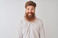 Young redhead irish man wearing shirt standing over isolated white background with a happy and cool smile on face Royalty Free Stock Photo