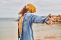 Young redhead man breathing at seaside