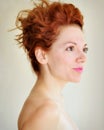 Young redhead with punky hair and tragus piercing Royalty Free Stock Photo