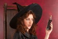 Young redhead witch with potions Royalty Free Stock Photo