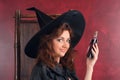 Young redhead witch with potions Royalty Free Stock Photo