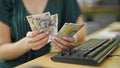 Young redhead woman business worker counting romanian leu banknotes at office