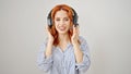 Young redhead woman call center agent speaking over isolated white background Royalty Free Stock Photo