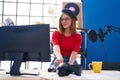 Young redhead woman musician smiling confident having dj session at music studio Royalty Free Stock Photo