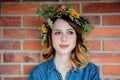 Young redhead woman with oak leaves wreath Royalty Free Stock Photo