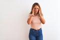 Young redhead woman stading over white isolated background with hand on head for pain in head because stress Royalty Free Stock Photo