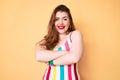 Young redhead woman wearing swimwear happy face smiling with crossed arms looking at the camera Royalty Free Stock Photo