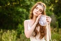 Young redheaded girl smiling and hold dreamcatcher Royalty Free Stock Photo