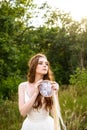 Young redheaded girl smiling and hold dreamcatcher Royalty Free Stock Photo