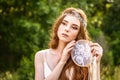 Young redheaded girl smiling and hold dreamcatcher Royalty Free Stock Photo