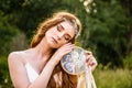 Young redheaded girl smiling and hold dreamcatcher Royalty Free Stock Photo