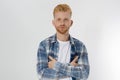 Young redheaded man with red beard in blank summer tshirt, plaid shirt isolated on white background. Unshaven confident serious Royalty Free Stock Photo