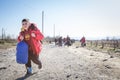 Young refugee child carrying heavy backpack on the Greece Macedonia border, between cities of Eidomeni Idomeni & Gevgelija