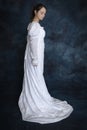 A young Regency woman wearing a white muslin dress and a pearl necklace Royalty Free Stock Photo