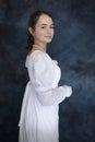 A young Regency woman wearing a white muslin dress and a pearl necklace Royalty Free Stock Photo