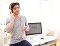 Young relaxed man listenning music at the office Royalty Free Stock Photo