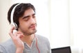 Young relaxed man listenning music at the office Royalty Free Stock Photo