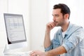 Young relaxed man using computer