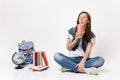 Young relaxed woman student with closed eyes hold plastic cup of soda or cola drinking sit near globe, backpack, school