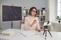 Young remote college or school teacher having online geometry class via video call Royalty Free Stock Photo