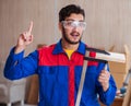 Young repairman carpenter working with clamps