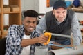 young repairman contractor cutting plastic pipe