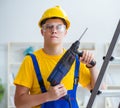 Young repairman with power drill Royalty Free Stock Photo