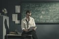 Young researcher studying mathematics in his office