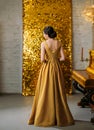 Retro woman. turned away. back finger wave hairstyle. elegant evening dress