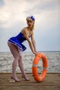 Young retro pinup girl with blond curly hair style and beau Royalty Free Stock Photo