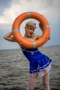 Young retro pinup girl with blond curly hair style and beau Royalty Free Stock Photo