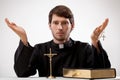 Young reverend with rosary and the Bible