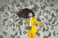 Young rich businessman standing in money rain Royalty Free Stock Photo