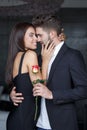 Young rich couple with rose dating Royalty Free Stock Photo